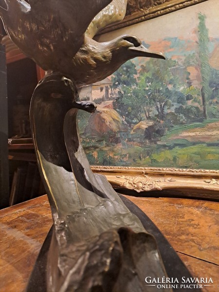 Old huge marked bronze seagull statue