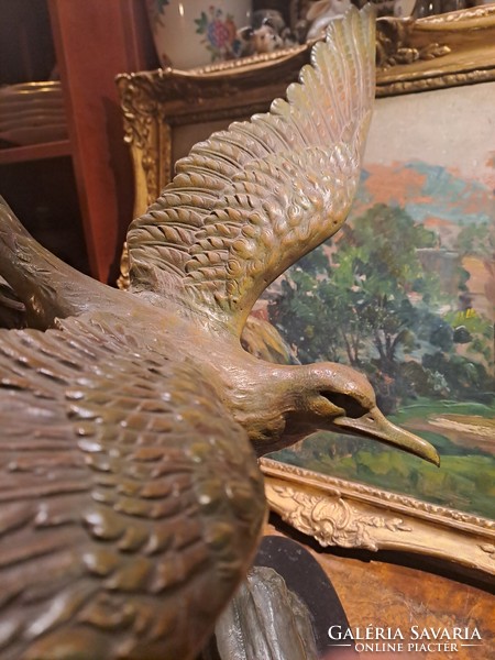 Old huge marked bronze seagull statue