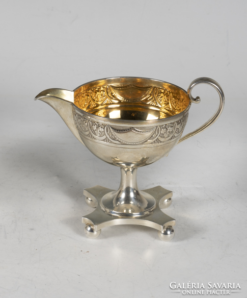 Silver milk jug with grape decoration