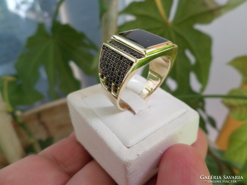 Modern gold men's ring with black stones