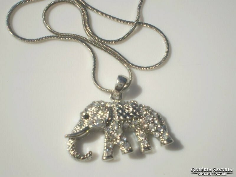 For half, a large elephant necklace
