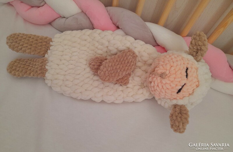 Hand crocheted sleeping plush lamb.
