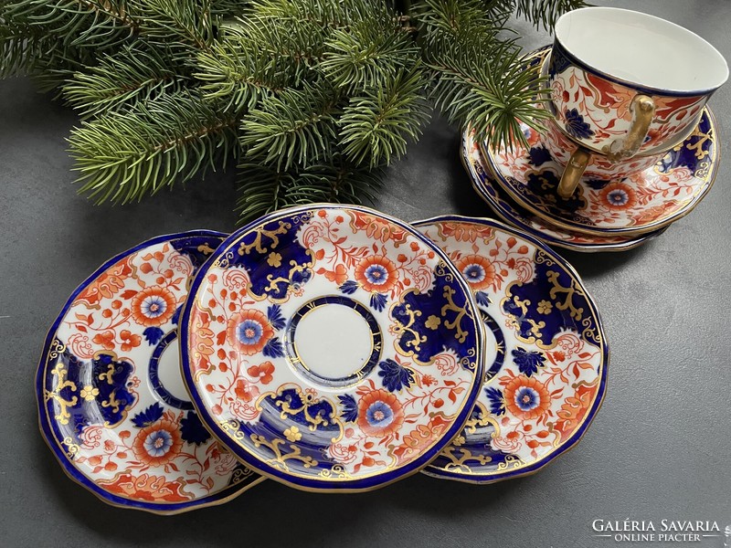Pair of hand-painted Imari pattern royal crown derby porcelain cups and small plates