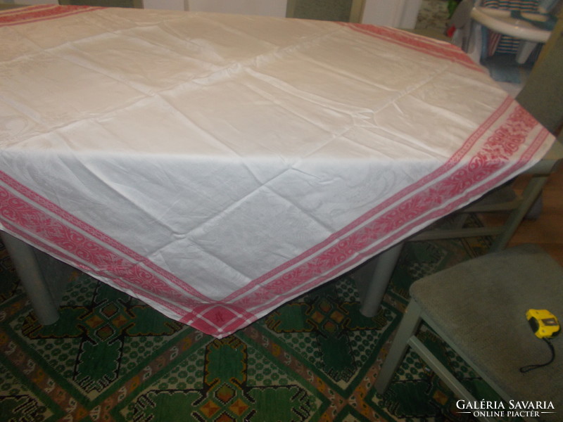 Very nice damask tablecloth with red edges