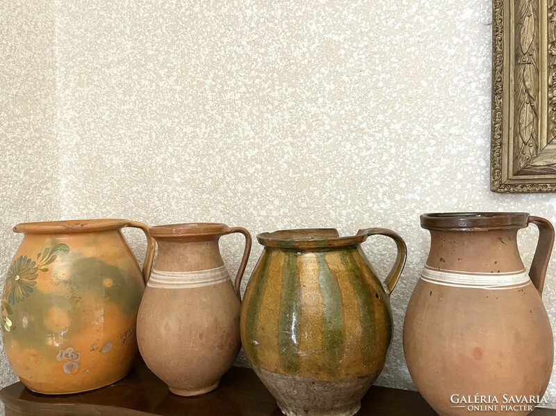 Large antique brown glazed earthenware pot with ceramic flower motif