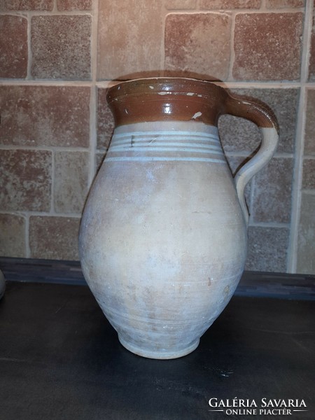 Traditional earthenware pot with striped decoration and glazed inside