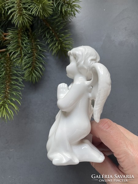 Beautifully crafted praying, snow-white porcelain angel face candle holder