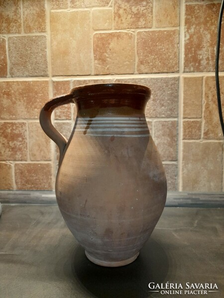 Traditional earthenware pot with striped decoration and glazed inside