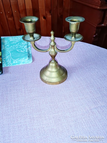 Old copper and silver colored candlesticks with 2 and 3 branches