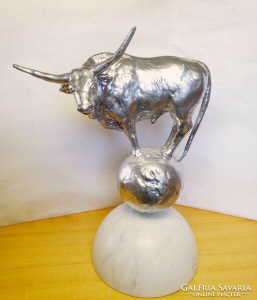 Hungarian gray beef bull. Silver-painted bronze statue on a marble plinth, signed