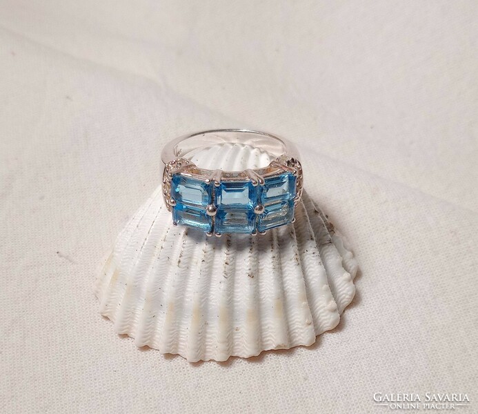 Old art deco style silver ring with blue topaz stones.