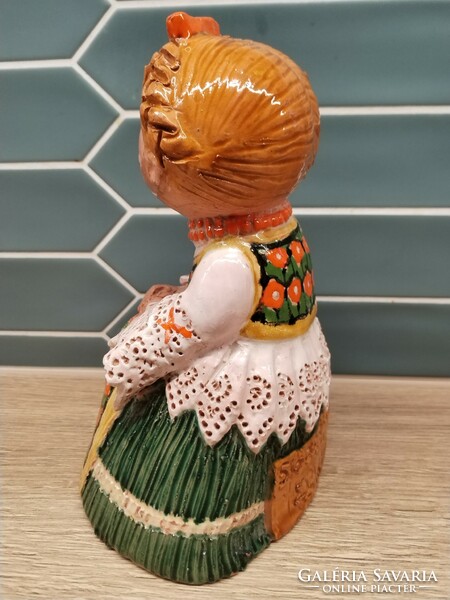 Ceramic statue of a lady in folk costume from Sióagárd