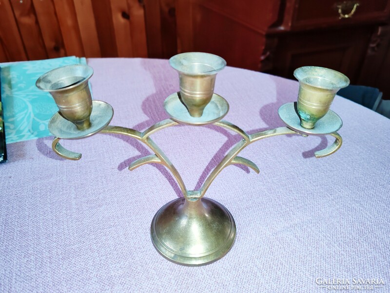 Old copper and silver colored candlesticks with 2 and 3 branches