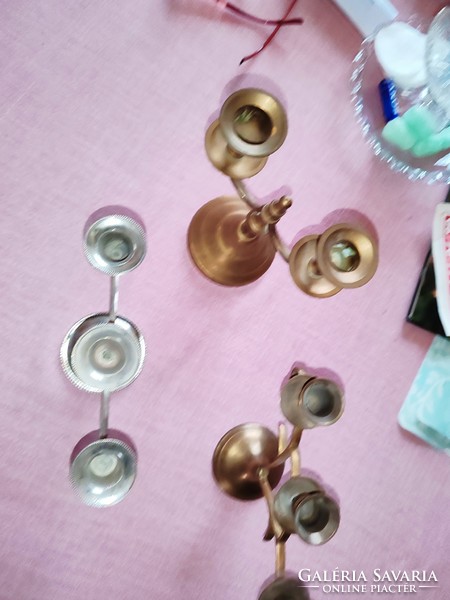 Old copper and silver colored candlesticks with 2 and 3 branches