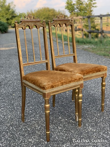 xvi. A pair of Louis-style French gilded chairs