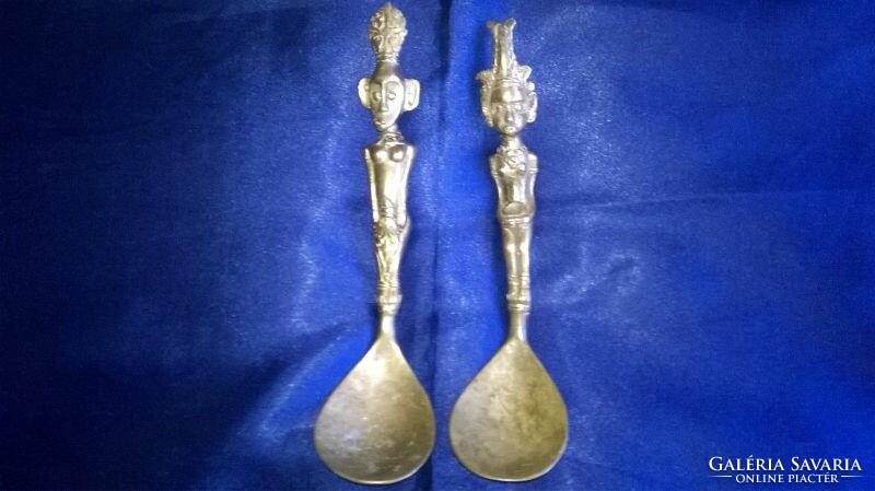 A rare pair of decorative copper spoons