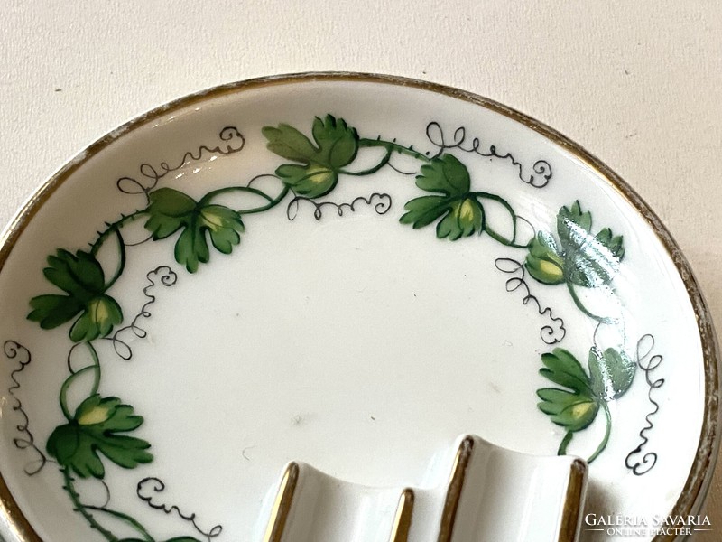 A 1950s painted porcelain ashtray with an art deco feel, painted with grape leaves