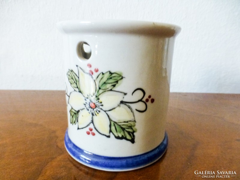 White poinsettia patterned ceramic candle holder