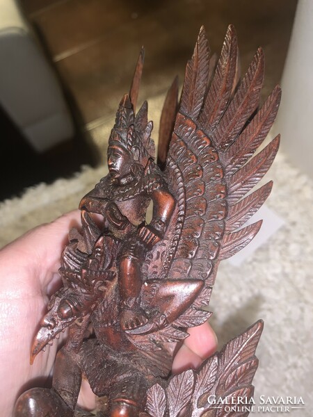 Indonesian hand carved detailed statue of vishnu riding on the back of a garuda