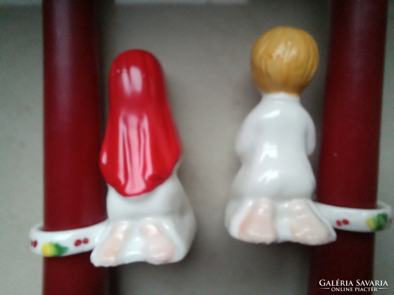 Pair of porcelain candle rings, praying figures