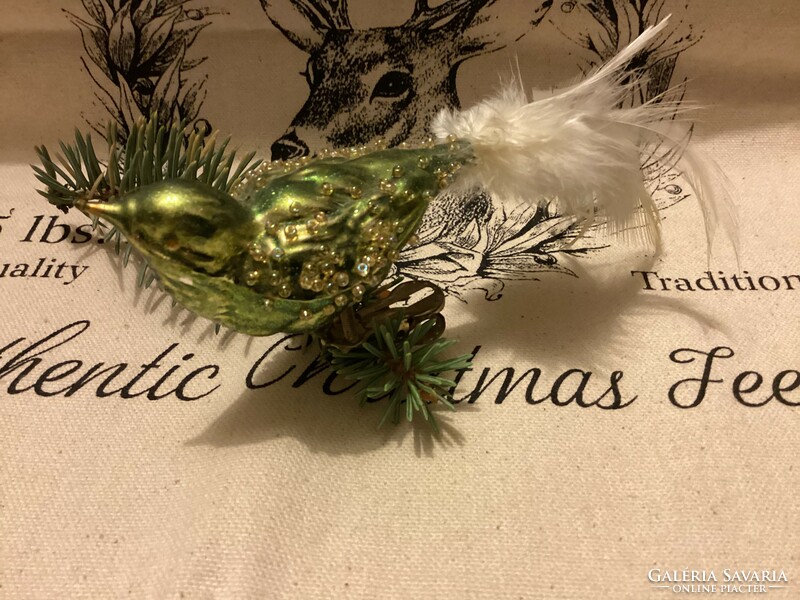 Green bird Christmas tree decoration with glass tweezers