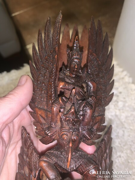 Indonesian hand carved detailed statue of vishnu riding on the back of a garuda