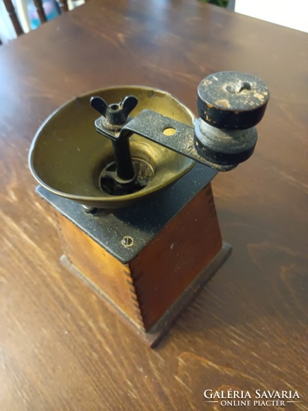 Biedermeier style coffee grinder with copper funnel.