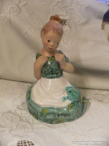 Butcher's gauze marked ceramic girl with a frog
