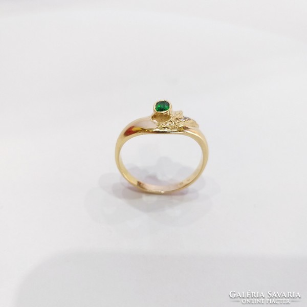 14 Carats, 3.16g. Gold women's ring with green stones, in new condition! (No. 23/53)