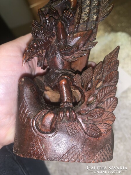 Indonesian hand carved detailed statue of vishnu riding on the back of a garuda