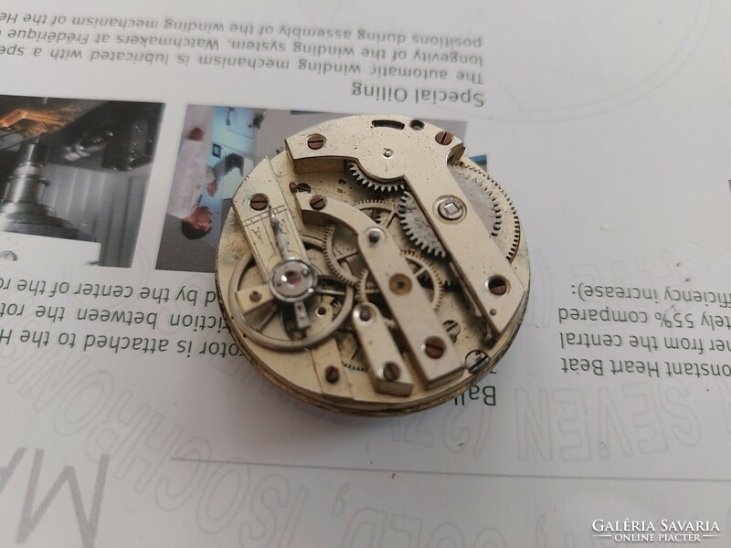 (K) remains of pocket watch, pendulum broken