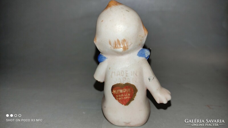 Antique kepwie doll damaged marked with a black cat