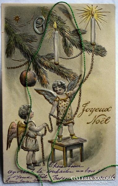 Antique embossed Christmas postcard - angels decorate a Christmas tree - for collection