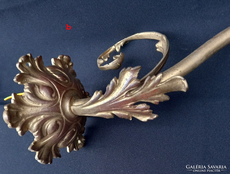 Two decorative antique copper wall brackets