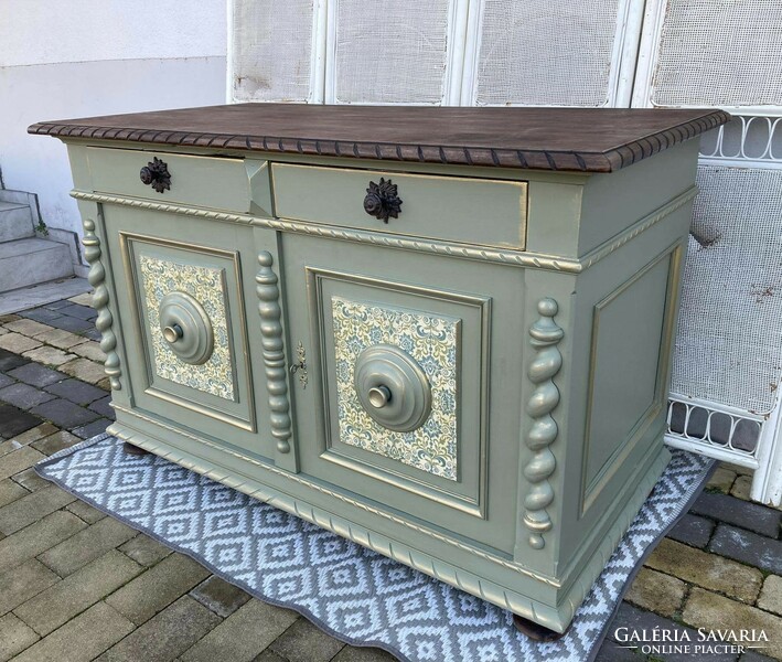 Very very old large chest of drawers, in a vintage atmosphere