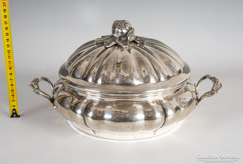 Silver covered bowl with a plastic pomegranate decoration on the lid