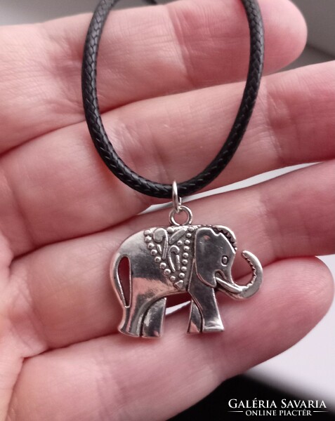 Silver-plated elephant pendant on a black necklace