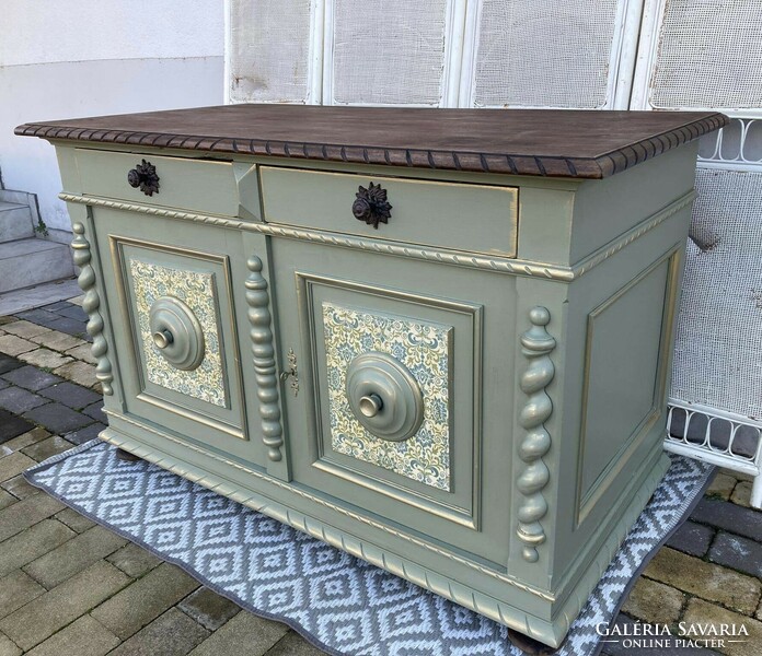 Very very old large chest of drawers, in a vintage atmosphere