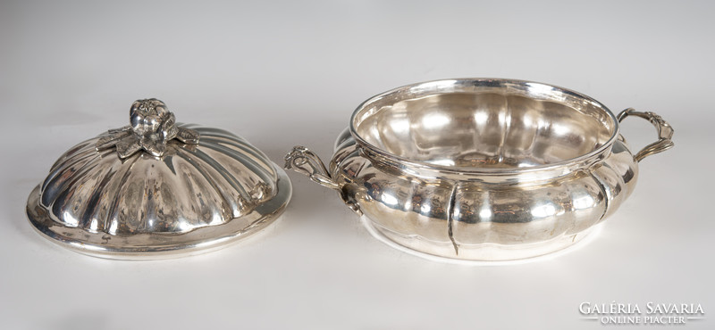 Silver covered bowl with a plastic pomegranate decoration on the lid