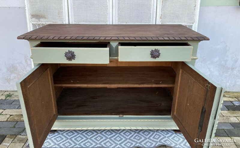 Very very old large chest of drawers, in a vintage atmosphere