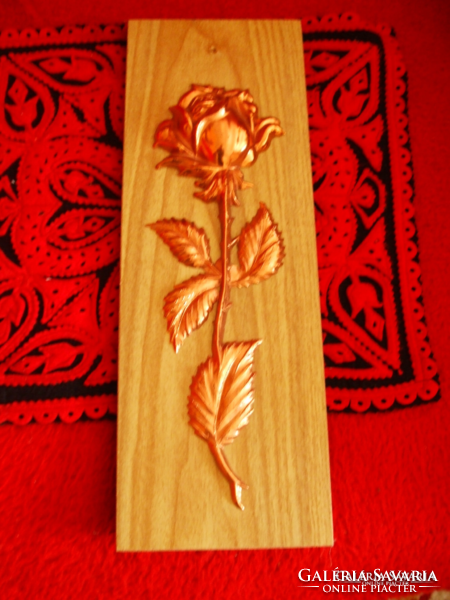 Copper roses on a wooden background, wall hanging not used