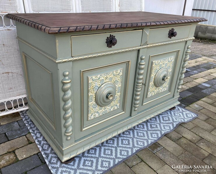 Very very old large chest of drawers, in a vintage atmosphere