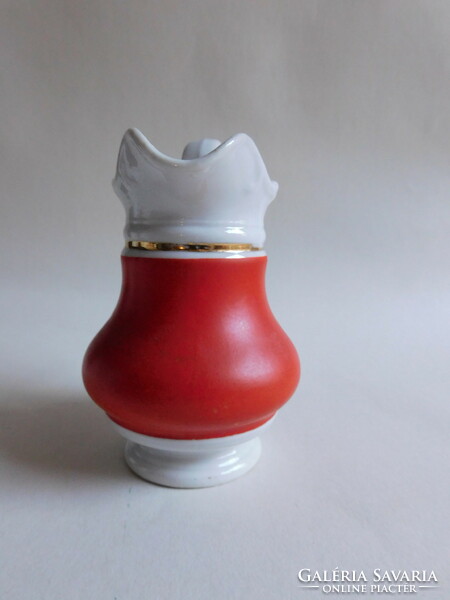 Antique red milk jug