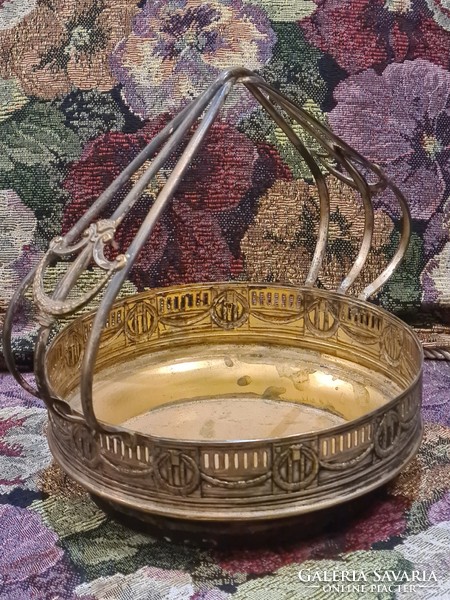 Antique copper basket with silver coating on the outside, center of the table, offering