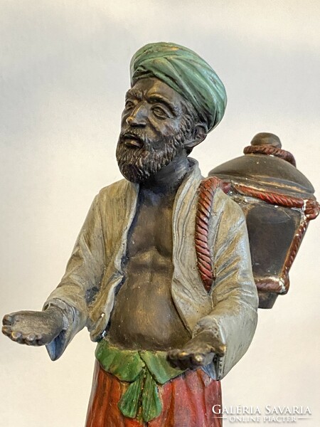 Large Viennese bronze water barrel oriental man