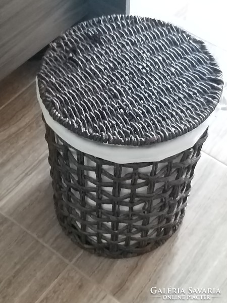 Wicker lined clothes basket storage