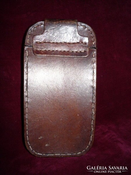 A leather case or holder for something