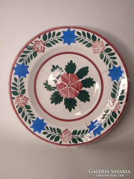 A painted folk hard-tile wall plate with the sign of Old Hóllóháza