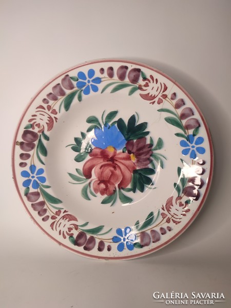 A painted folk hard-tile wall plate with the sign of Old Hóllóháza