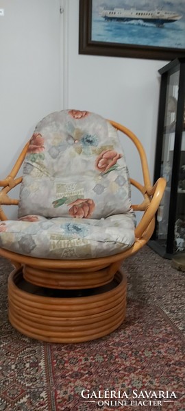Rattan stained swivel armchair with cushion